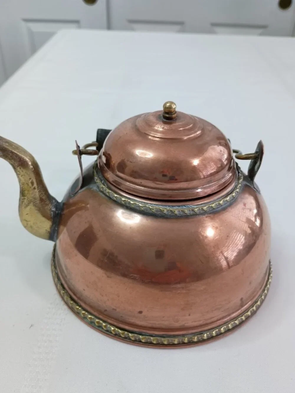 Vintage Handcrafted Rustic Teapot with Brass Accents and Black Handle